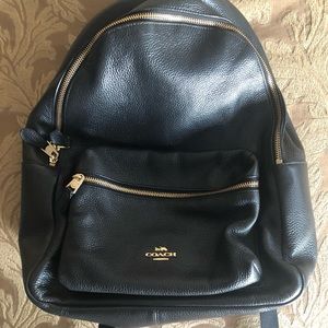 Coach black and gold backpack